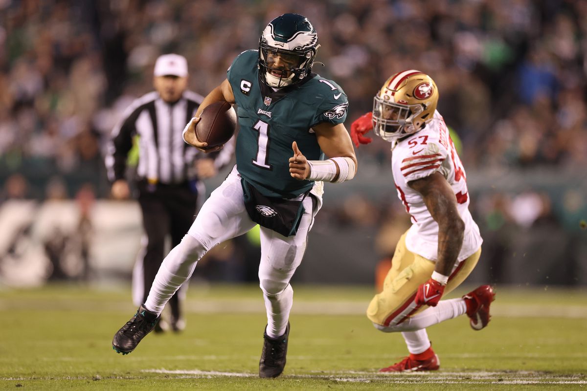 Jalen Hurts #1 of the Philadelphia Eagles runs the ball against Dre Greenlaw #57 of the San Francisco 49ers during the third quarter in the NFC Championship Game at Lincoln Financial Field on January 29, 2023 in Philadelphia, Pennsylvania.
