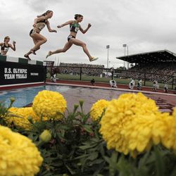 Bridget Franek, right, and Shalaya Kipp make the water jump in the women's 3,000-meter steeplechase final at the U.S. Olympic Track and Field Trials on Friday, June 29, 2012, in Eugene, Ore. Franek finished second and Kipp finished third.