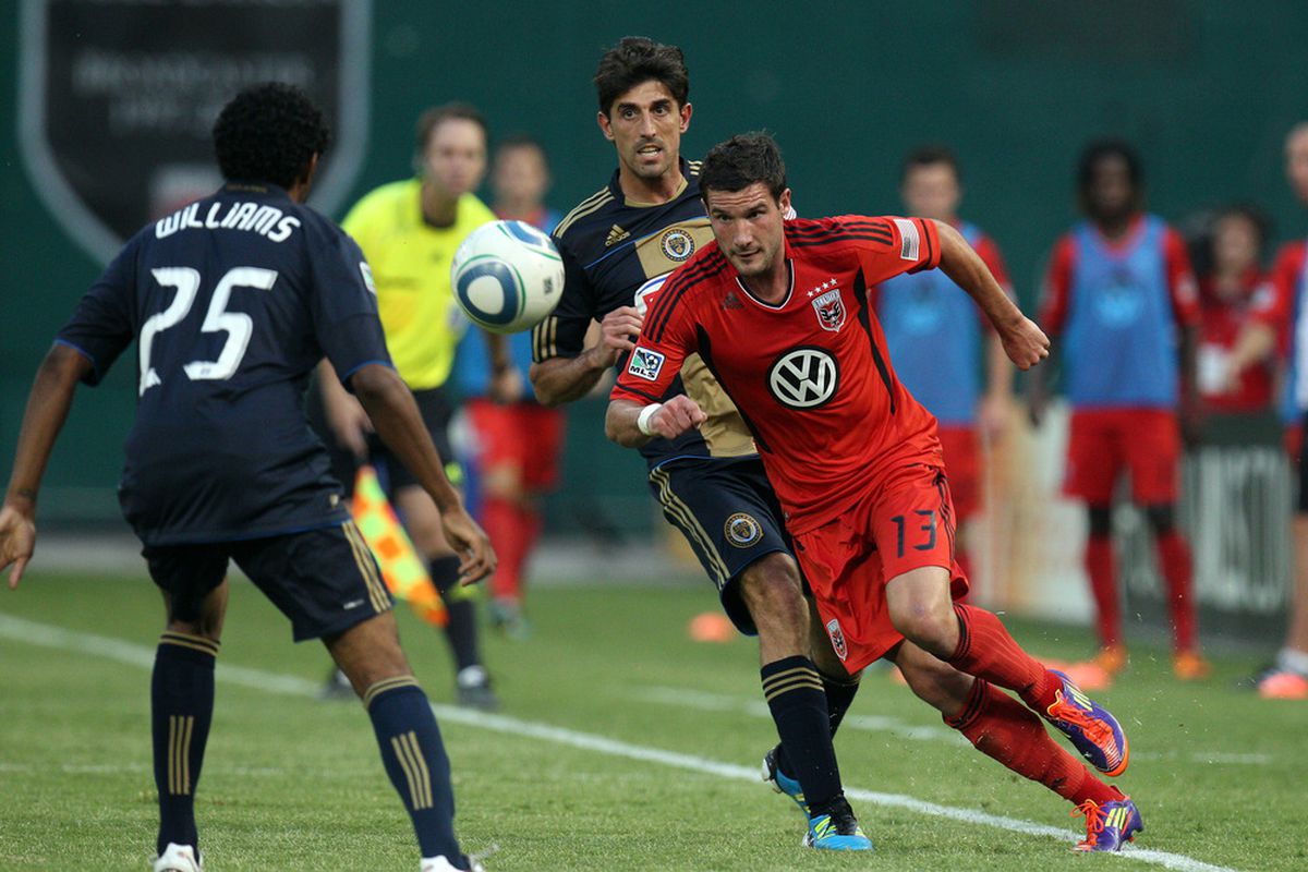 WASHINGTON, DC - JULY 2: Chris Pontius #13 of D.C. United controls the ball against Sheanon Williams #25 of the Philadelphia Union at RFK Stadium on July 2, 2011 in Washington, DC. (Photo by Ned Dishman/Getty Images)