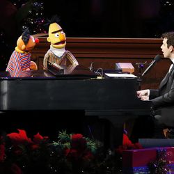 Santino Fontana and the "Sesame Street" Muppets perform with the Mormon Tabernacle Choir during the choir's  annual Christmas concert in Salt Lake City Thursday, Dec. 11, 2014. 