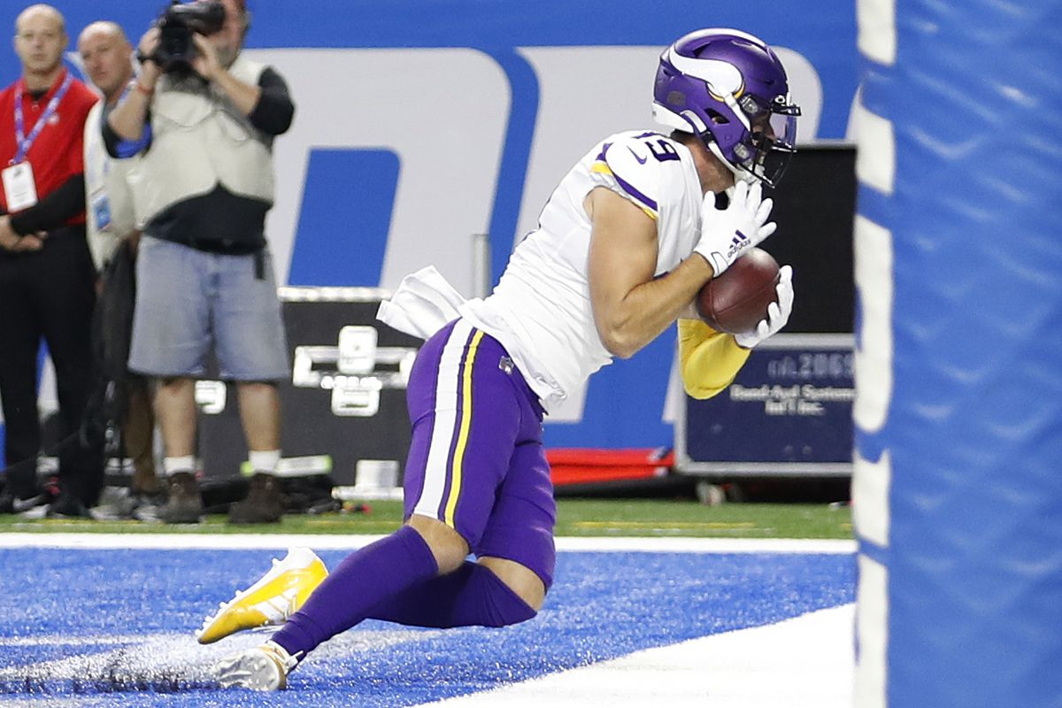 Minnesota Vikings wide receiver Adam Thielen makes a catch for a touchdown during the first quarter against the Detroit Lions at Ford Field.