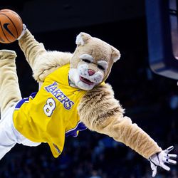 Cosmo the Cougar dunks the ball in honor of late NBA legend Kobe Bryant during halftime in Provo on Thursday, Jan. 30, 2020.