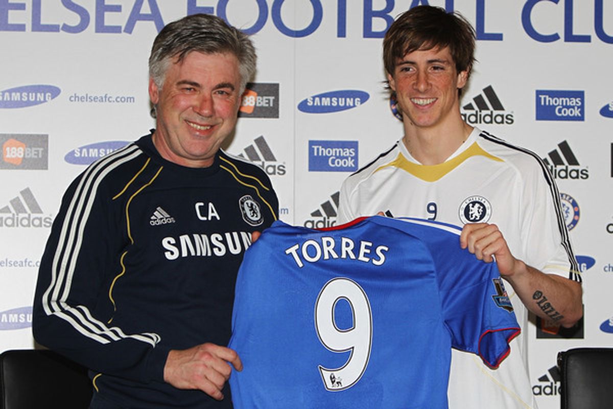 COBHAM ENGLAND - FEBRUARY 04:  Manager Carlo Ancelotti (L) and Fernando Torres pose for the media at the Chelsea Press Conference on February 4 2011 in Cobham England.  (Photo by Dean Mouhtaropoulos/Getty Images)