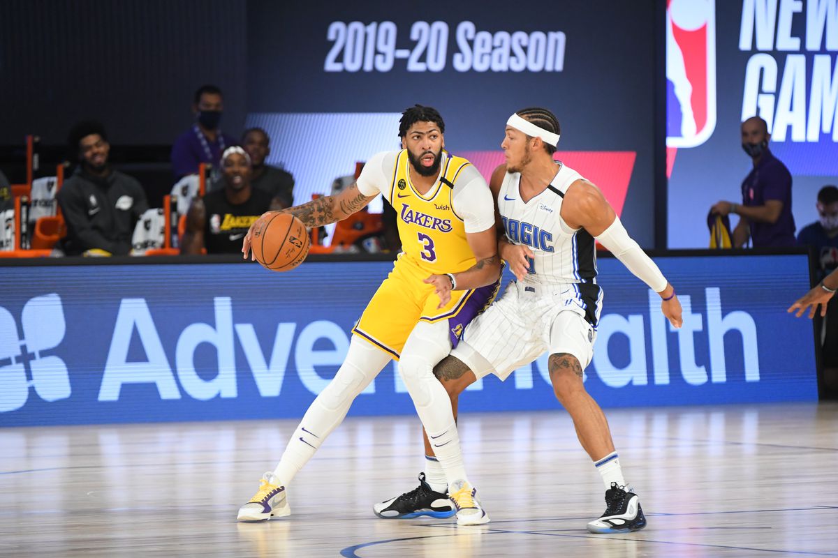 Anthony Davis of the Los Angeles Lakers handles the ball against the Orlando Magic during a scrimmage on July 25, 2020 at HP Field House at ESPN Wide World of Sports in Orlando, Florida.