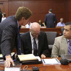 George Zimmerman, far right, has a discussion with defense attorneys Mark O'Mara, left,  and Don West, in Seminole circuit court during a pretrial hearing, in Sanford, Fla., Saturday, June 8, 2013. Circuit Judge Debra Nelson halted the hearing Saturday after an audio expert was unable to testify because he was stuck at an airport. She will issue a ruling after testimony is concluded.  