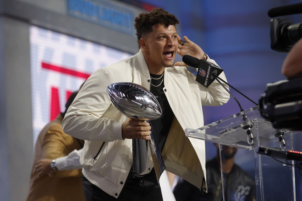 Patrick Mahomes #15 of the Kansas City Chiefs celebrates onstage with the Vince Lombardi Trophy during the first round of the 2023 NFL Draft at Union Station on April 27, 2023 in Kansas City, Missouri.