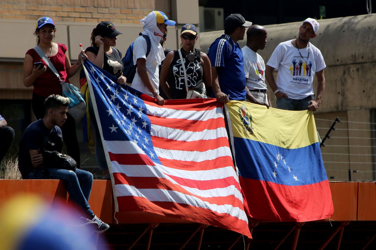 Supporters of Juan Guaidó show flags of United States and Venezuela during a May 1, 2019 demonstration in Caracas, Venezuela.