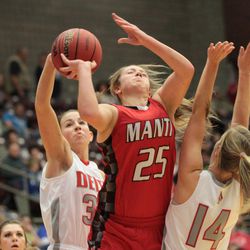 Sidney Springer blocks the shot of Amanda Naylor as Delta defeats Manti 54-29 on Feb. 27, 2015, in the 2A girls semifinals. 