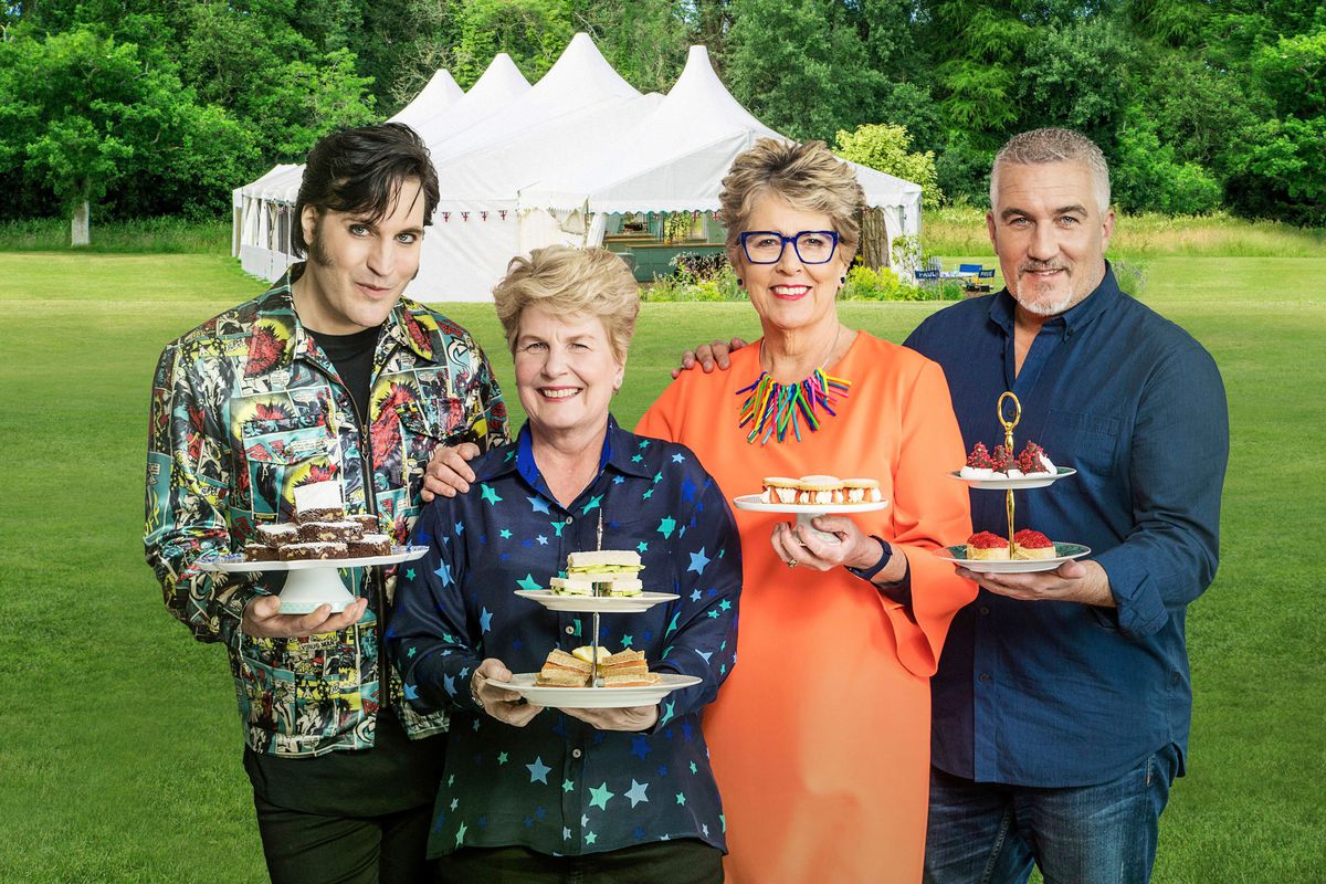Great British Bake Off 2019 judges Paul Hollywood, Noel Fielding, Prue Leith, and Sandi Toksvig pose with British cakes ahead of the new series on Channel 4