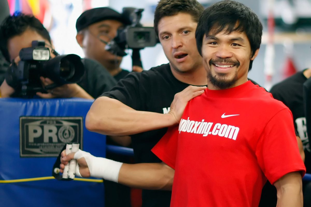 Alex Ariza says that Manny Pacquiao looks good in camp, but he's worried the star might be pushing too hard. (Photo by Jeff Gross/Getty Images)