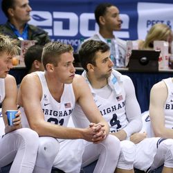 Brigham Young Cougars forward Eric Mika (12), forward Kyle Davis (21), guard Nick Emery (4) and guard TJ Haws (30) sit together on the bench during a game at the Marriott Center in Provo on Saturday, Nov. 19, 2016.
