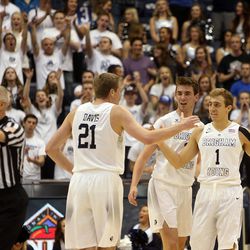 The Brigham Young Cougars celebrate during a timeout in the first round of the NIT versus the UAB Blazers at the Marriott Center in Provo, Wednesday, March 16, 2016.