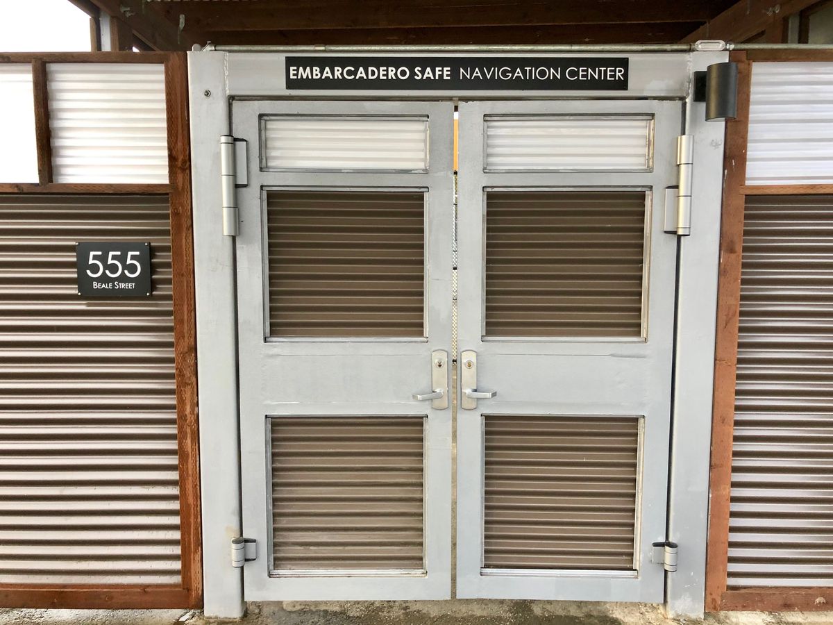 A gate with a sign reading “Embarcadero Safe Navigation Center.”