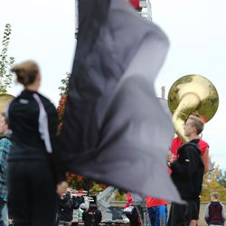 John Miller, American Fork Marching Band director, top, watches from high in a scissor lift as band members practice Wednesday, Oct. 28, 2015. Miller is preparing to retire after more than 30 years of teaching.