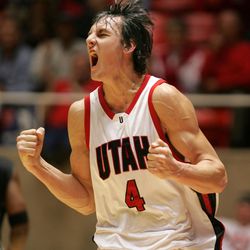 The University of Utah's Andrew Bogut celebrates during a basketball game.