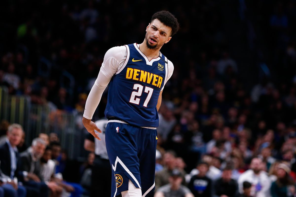 Denver Nuggets guard Jamal Murray reacts after a play in the fourth quarter against the Golden State Warriors at the Pepsi Center.
