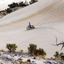 A person rides an off road vehicle on BLM land at Little Sahara, Wednesday, Sept. 14, 2011.