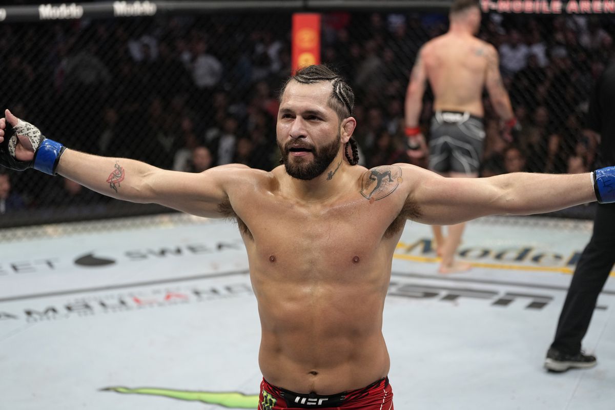 Jorge Masvidal walks back to his corner after the first round of his UFC 272 fight with Colby Covington.