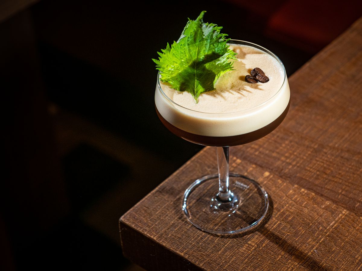 An espresso martini on a wooden table