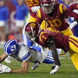 Brigham Young wide receiver Puka Nacua (12) recovers a fumble during the first half of an NCAA college football game against Southern California in Los Angeles, Saturday, Nov. 27, 2021. 