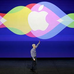 FILE - In this Wednesday, Sept. 9, 2015, file photo, Apple CEO Tim Cook waves during the Apple event at the Bill Graham Civic Auditorium in San Francisco. Apple is expected to unveil some new additions to its current family of iPhone and iPad devices at the company's product announcement on Monday, March 21, 2016. So far, however, there have been no hints of any dramatic announcements, such as 2015’s highly anticipated Apple Watch debut, or major initiatives like the company’s long-rumored but yet-to-materialize streaming TV service. 