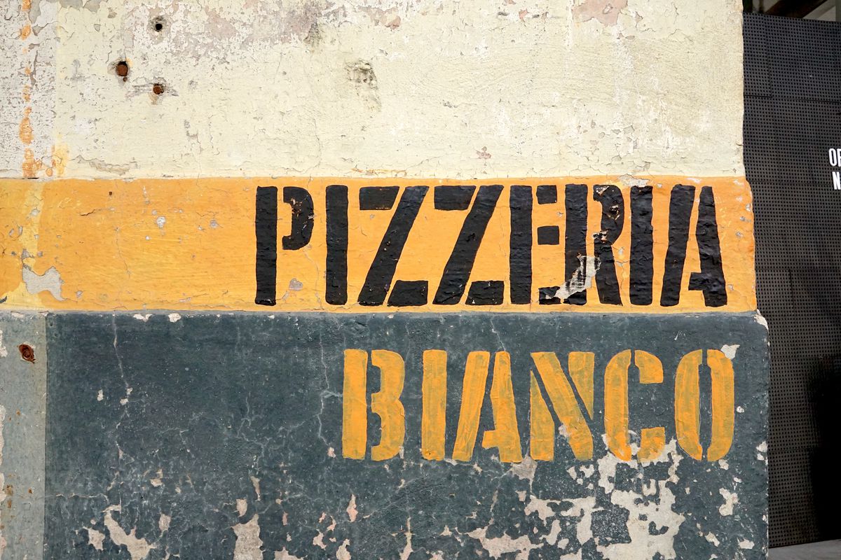 Orange and black signage at the new Pizzeria Bianco in Los Angeles.