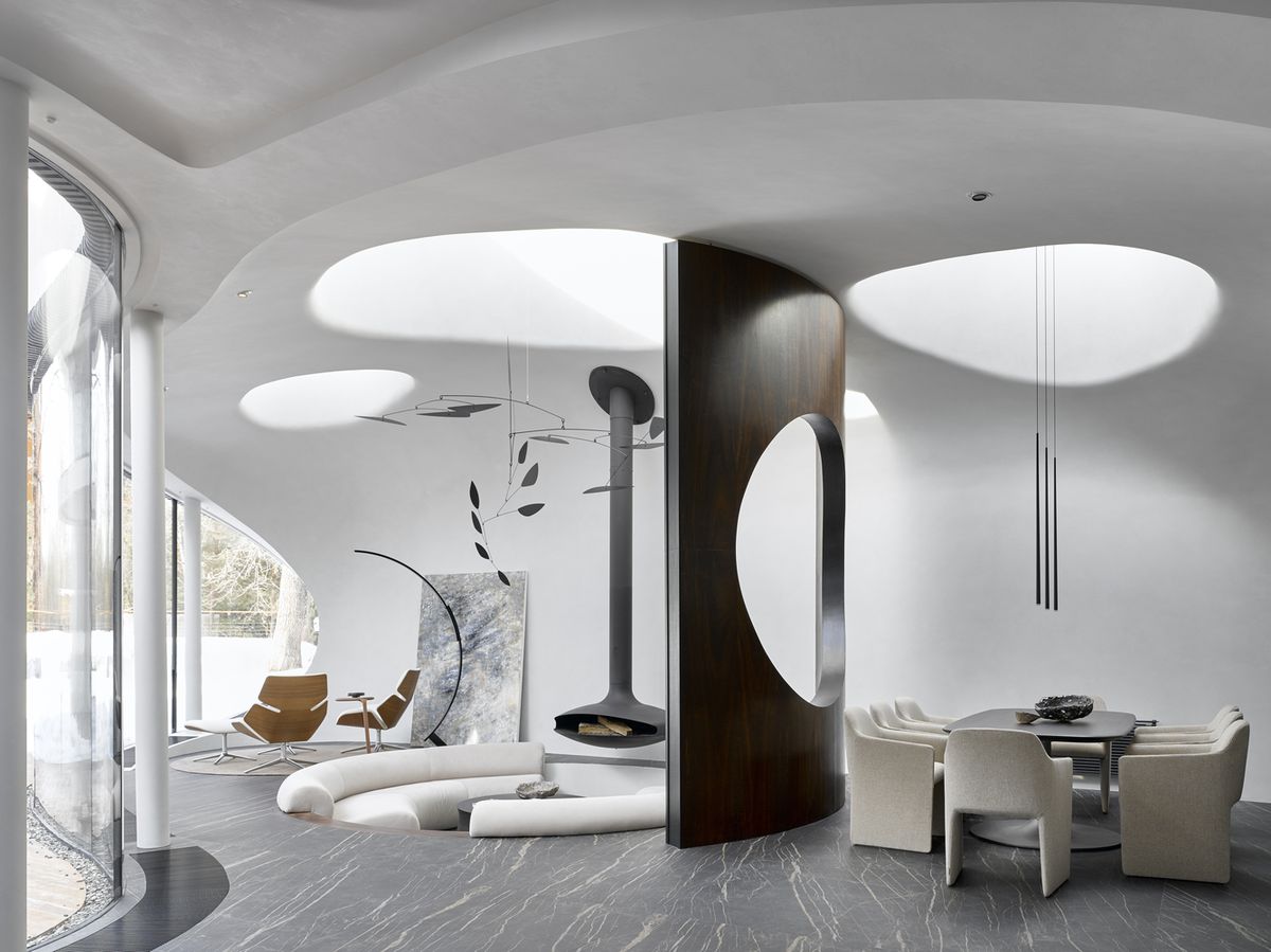 Living room with round skylights and round conversation pit.