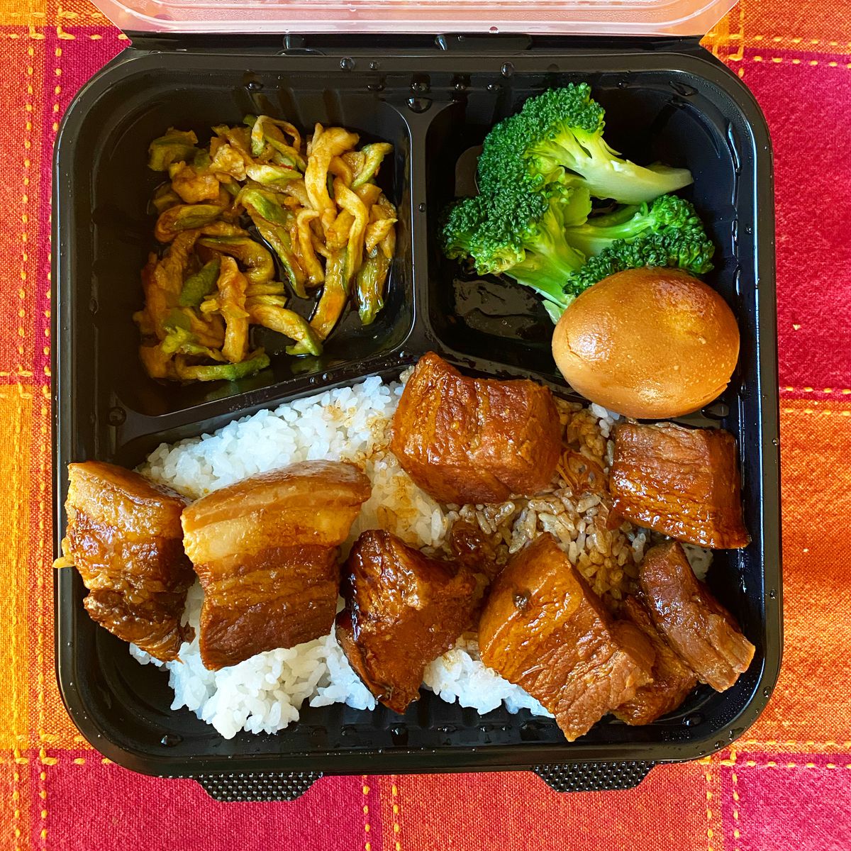 Shanghainese red braised pork at No. 1 Express in Arcadia in a plastic takeout container.