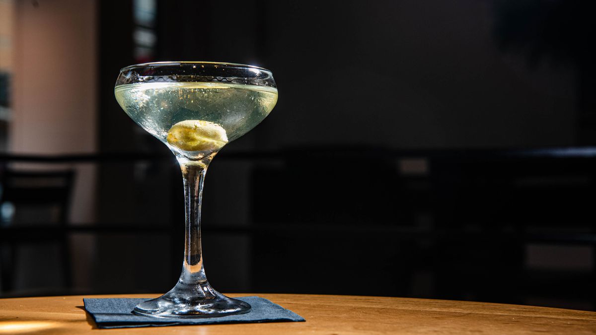 A martini standing on a bar
