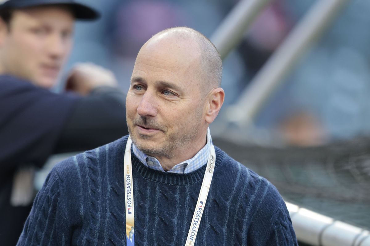 New York Yankees GM Brian Cashman watches batting practice before Game 3 of ALDS