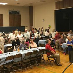LDS Church members and others associated with the Ogden Deaf Branch gather for lunch on a Saturday when they commemorated 100 years since the branch was founded.