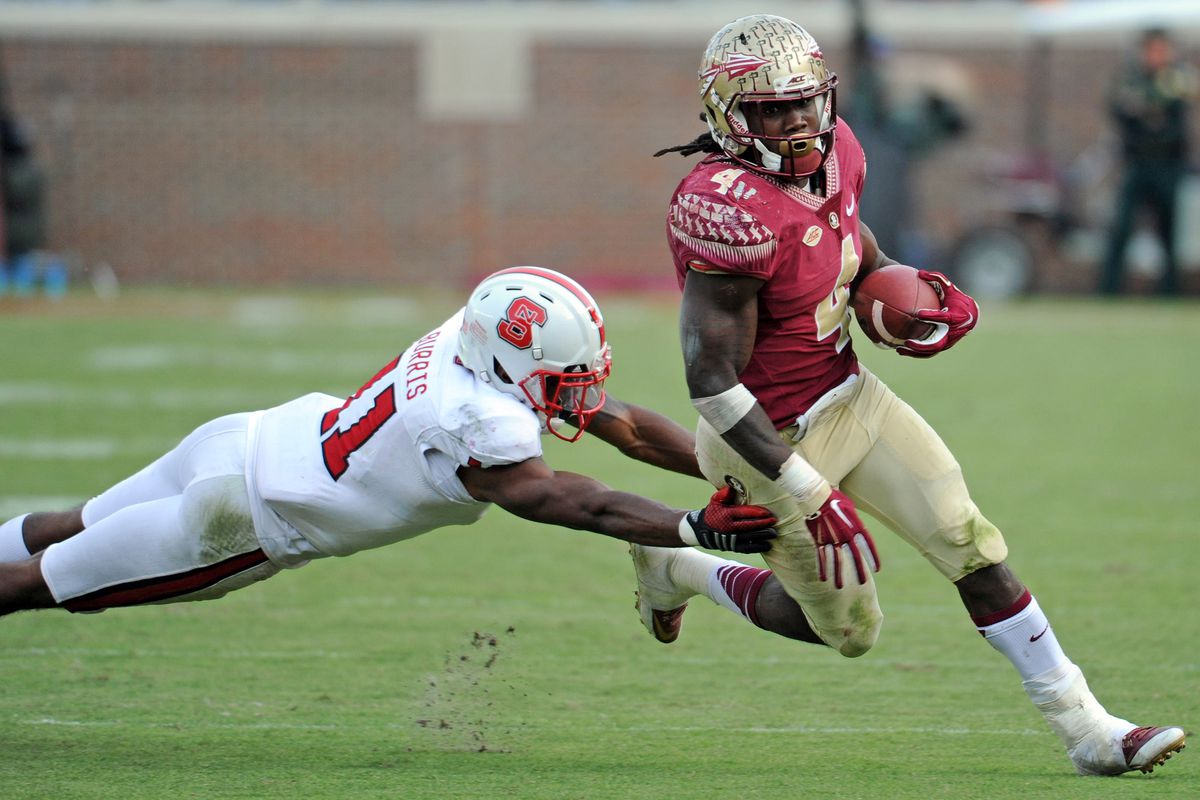Dalvin Cook evades an NC State tackler