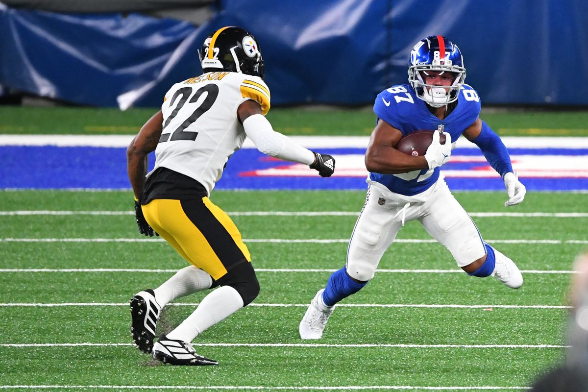New York Giants wide receiver Sterling Shepard runs after a catch while Pittsburgh Steelers cornerback Steven Nelson defends during the third quarter at MetLife Stadium.