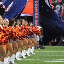 The Denver Broncos Cheerleaders are all smiles waiting for the team’s entry.
