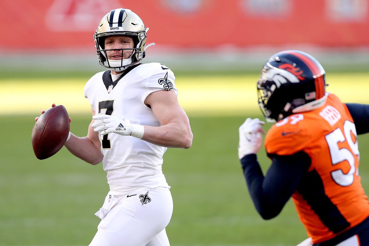 Taysom Hill #7 of the New Orleans Saints looks to pass during the second quarter of a game against the Denver Broncos at Empower Field At Mile High on November 29, 2020 in Denver,