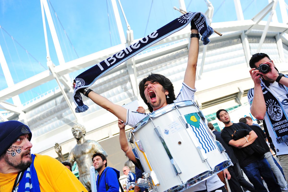VANCOUVER, CANADA - JUNE 20:  A Vancouver Whitecaps fan cheers on his team prior to their game against the New York Red Bulls at B.C. Place on June 20, 2012 in Vancouver, British Columbia, Canada. (Photo by Jessica Haydahl/Getty Images)