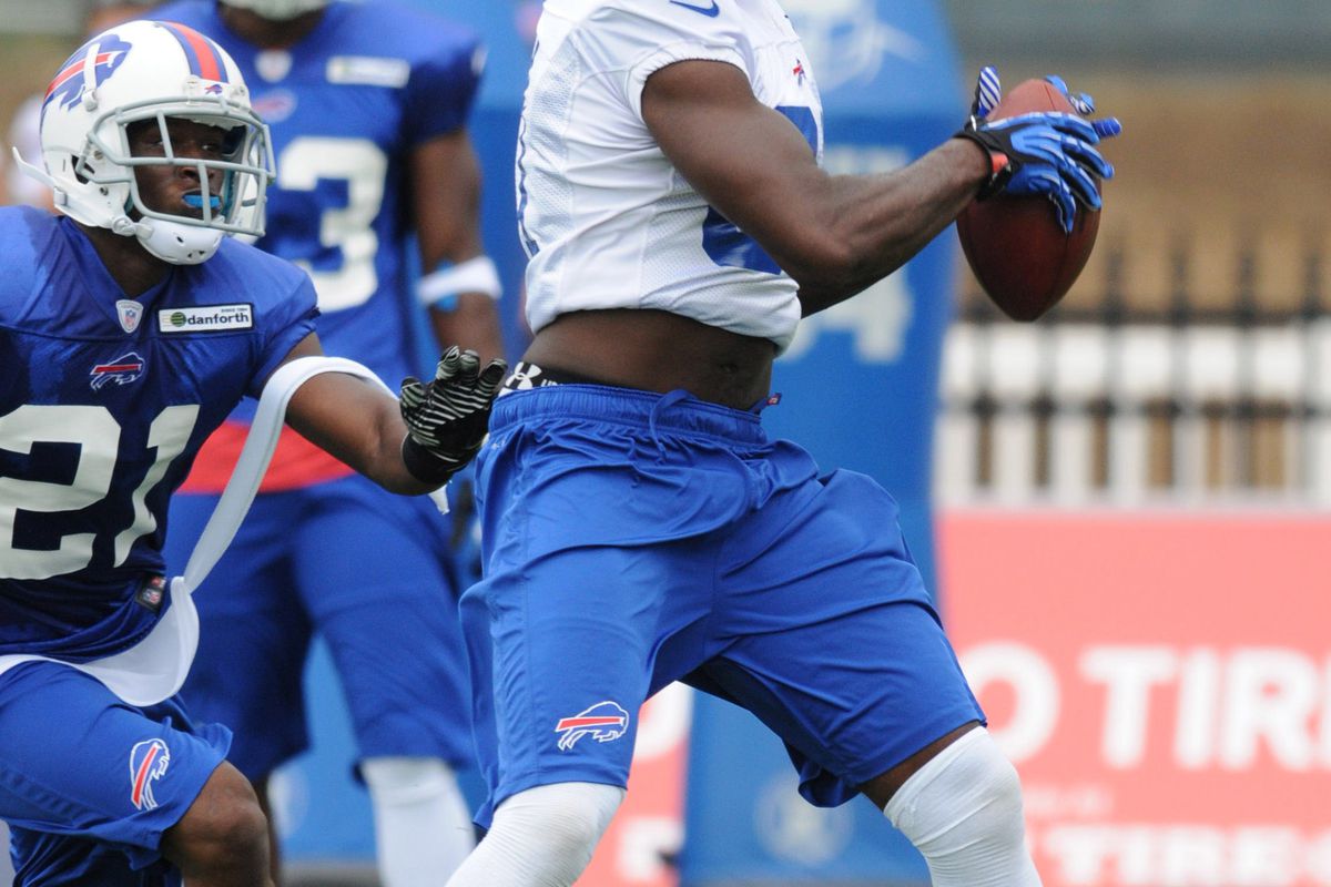 July 26, 2012; Pittsford, NY, USA; Buffalo Bills wide receiver Marcus Easley (81) makes a catch in front of defensive back Leodis McKelvin (21) during training camp practice at St. John Fisher College.   Mandatory Credit: Mark Konezny-US PRESSWIRE