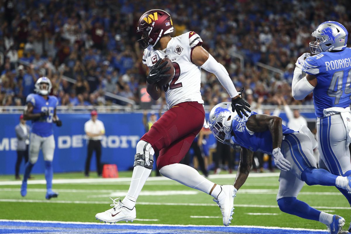 Logan Thomas #82 of the Washington Commanders scores a touchdown during an NFL football game against the Detroit Lions at Ford Field on September 18, 2022 in Detroit, Michigan.