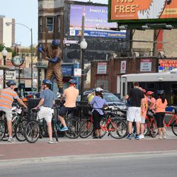 5:07 p.m. Bicycle tour group, stopping in front of the ballpark - 