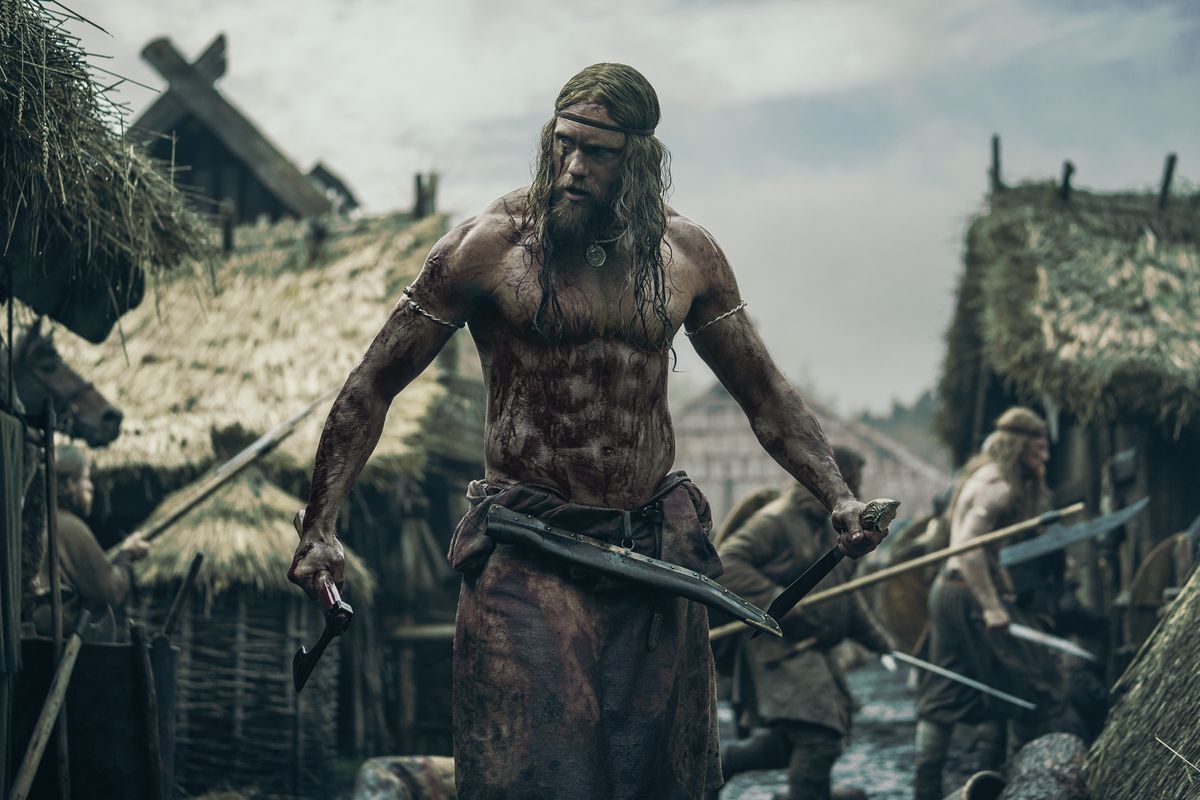 Alexander Skarsgård stands as a Viking warrior in The Northman