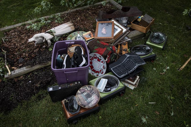 Kris Florczak, 70, salvages what she can from her home, including family photos and heirlooms, on Janes Avenue near Evergreen Lane in Woodridge after a tornado ripped through the western suburbs overnight, Monday morning, June 21, 2021. | Ashlee Rezin Garcia/Sun-Times