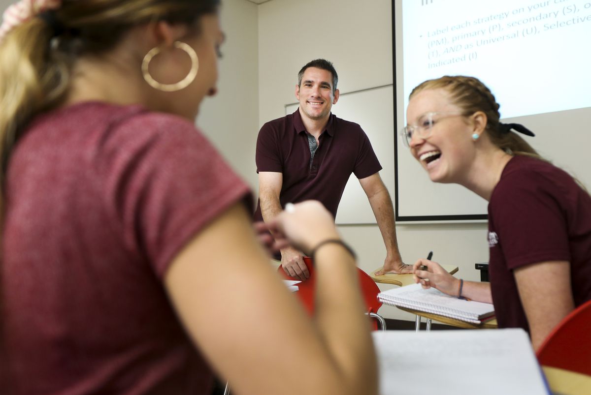 Professor Nick Galli, center, discusses a topic with Haylee Osgood, left, and Jayne Hansen during his Community Based Prevention Practices in Health Promotion and Education class in the William Stewart Building on the University of Utah campus in Salt Lake City on Thursday, Aug. 29, 2019.