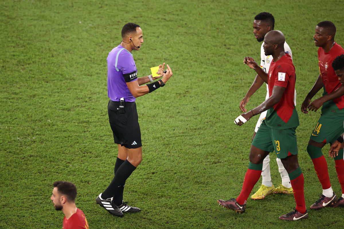 Referee Ismail Elfath speaks with Danilo Pereira of Portugal and Inaki Williams of Ghana during the FIFA World Cup Qatar 2022 Group H match between Portugal and Ghana at Stadium 974 on November 24, 2022 in Doha, Qatar.
