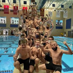Box Elder’s boys swimming team celebrates winning the Region 5 championship at South Davis Rec Center.