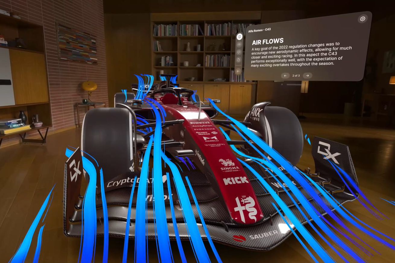 JigSpace app running in Apple’s visionOS, showing a 3D model of an F1 car projected in augmented reality simulating airflow modeling