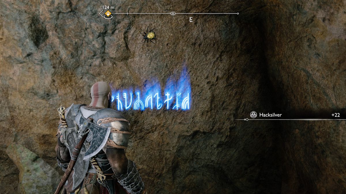 Kratos reads some runes off a wall in God of War Ragnarök