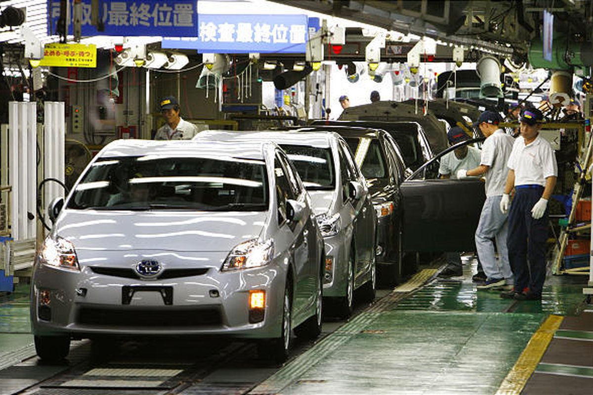In this June 5, 2009 file photo, workers give the final checkup on new Prius hybrid vehicles at Toyota Tsutsumi Plant in Toyota, central Japan.