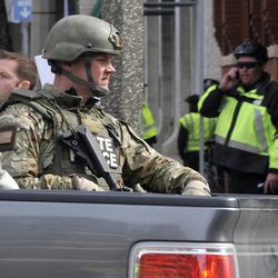Armed Massachusetts State Police roll into the area following an explosion at the 2013 Boston Marathon in Boston, Monday, April 15, 2013. Two explosions shattered the euphoria of the Boston Marathon finish line on Monday, sending authorities out on the course to carry off the injured while the stragglers were rerouted away from the smoking site of the blasts.