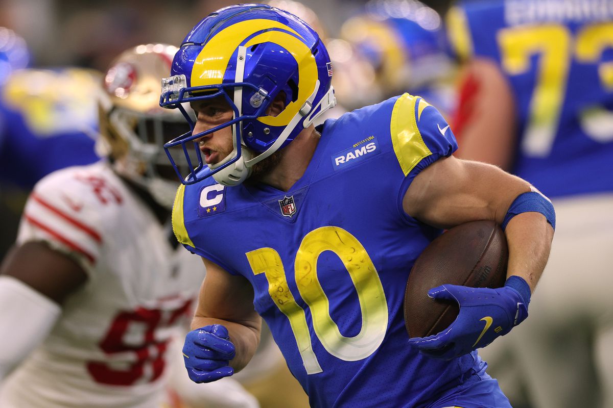 Cooper Kupp #10 of the Los Angeles Rams runs after a handoff during a 27-24 loss to the San Francisco 49ers at SoFi Stadium on January 09, 2022 in Inglewood, California.