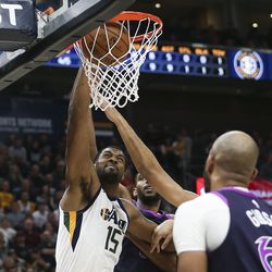 Utah Jazz forward Derrick Favors (15) dunks the ball against the Minnesota Timberwolves at Vivint Arena in Salt Lake City on Thursday, March 14, 2019.